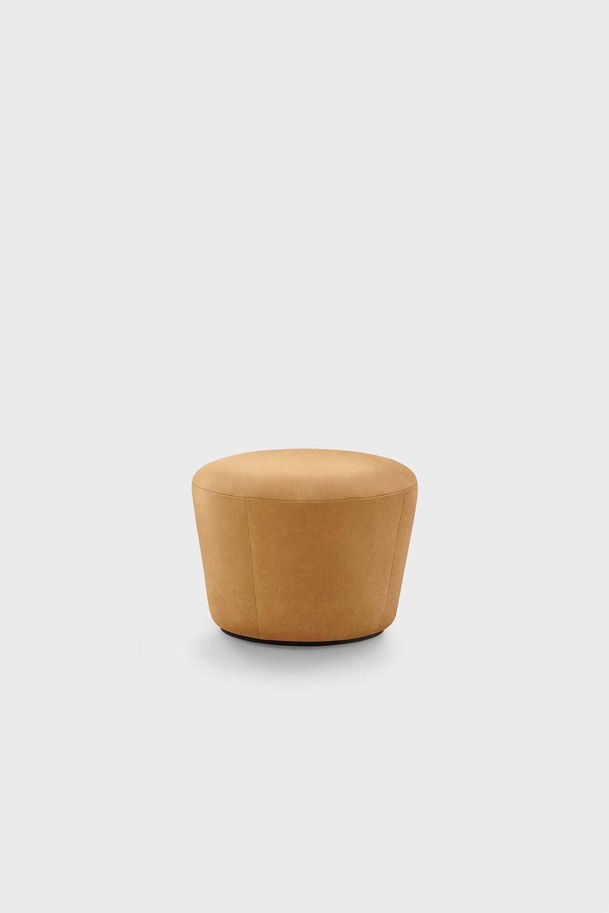 A round, tan pouf against a plain background.