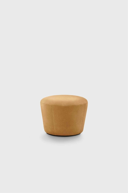 Cylindrical pouf in mustard yellow upholstery, minimal background, plain style.