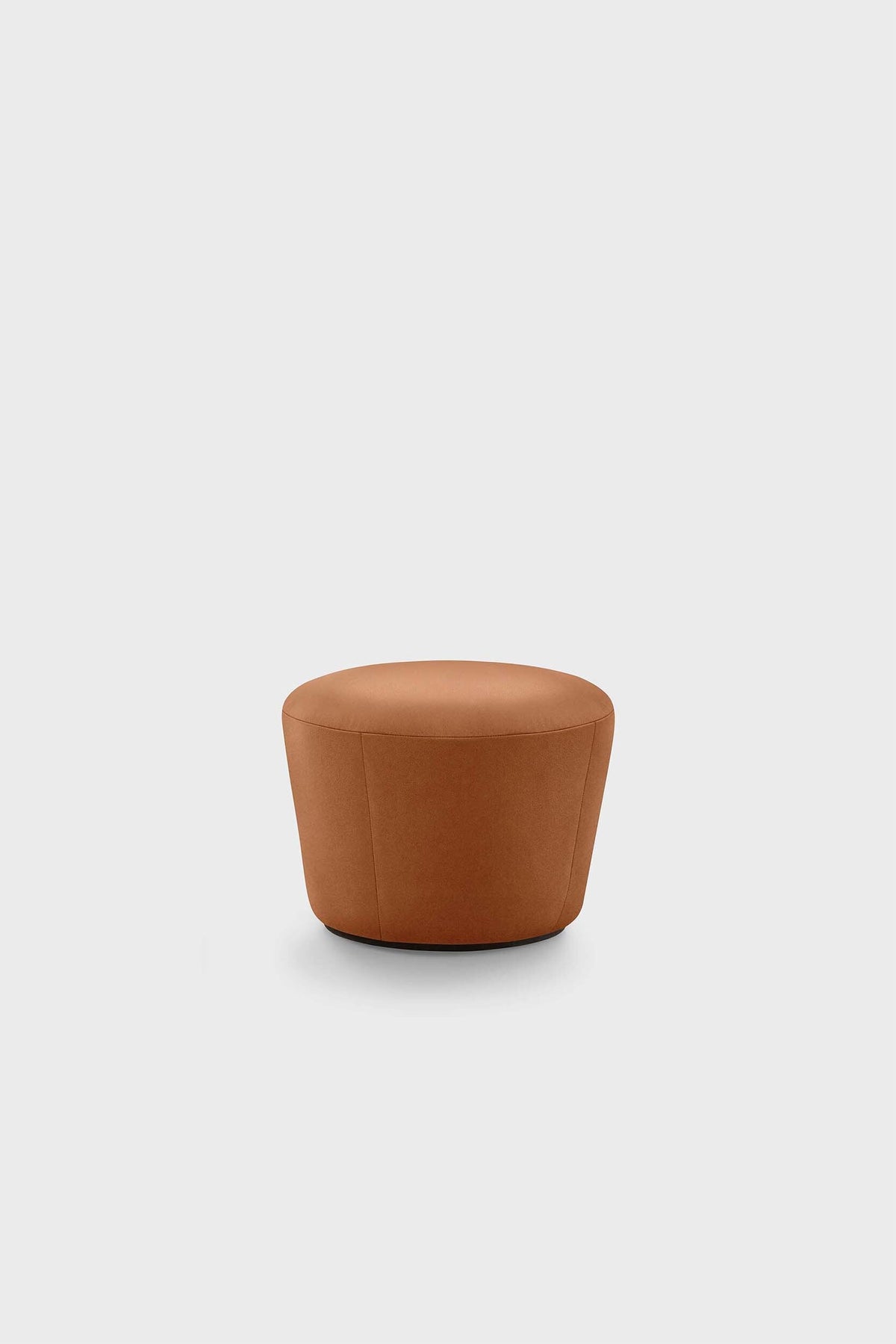 Circular, cushion-like furniture with a smooth texture in a warm beige tone against a plain background.