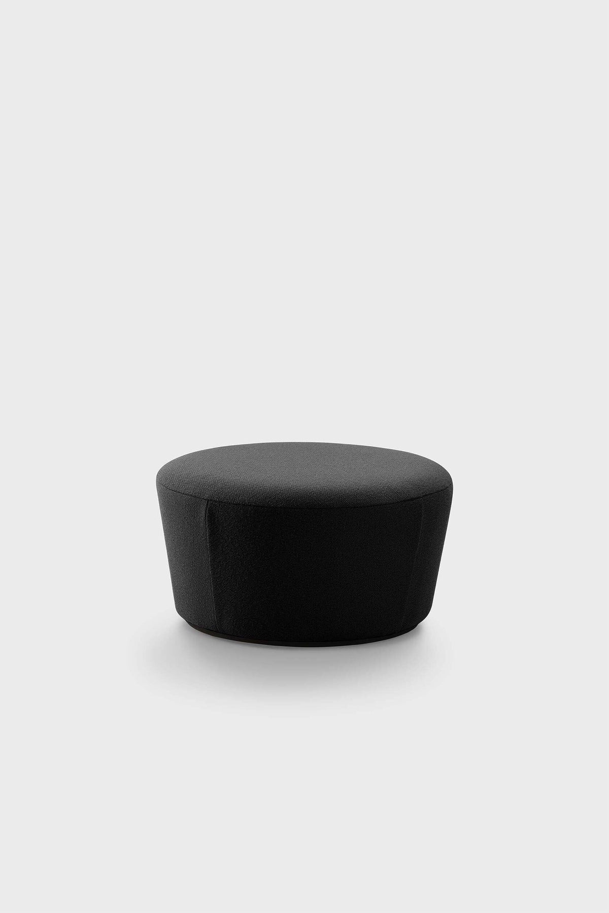 Black round pouf with smooth fabric texture