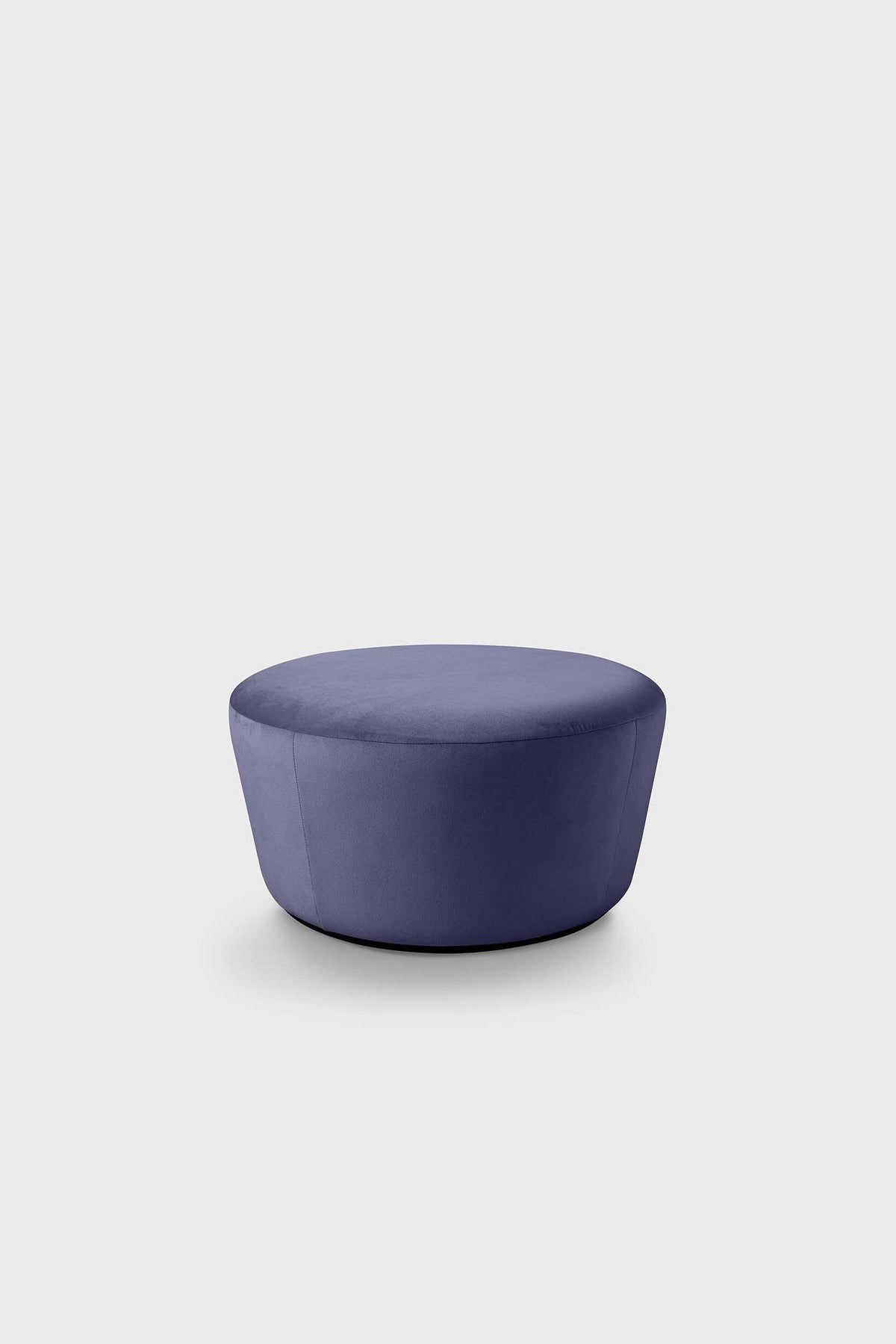 Round blue upholstered pouf