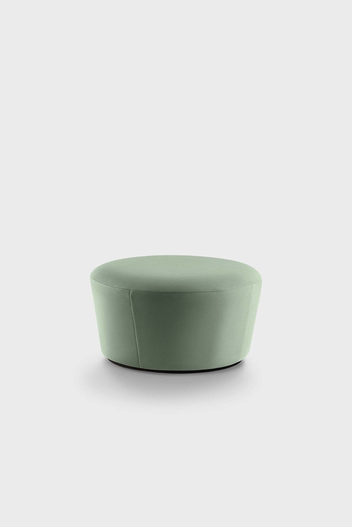 Circular green pouf on plain white background.