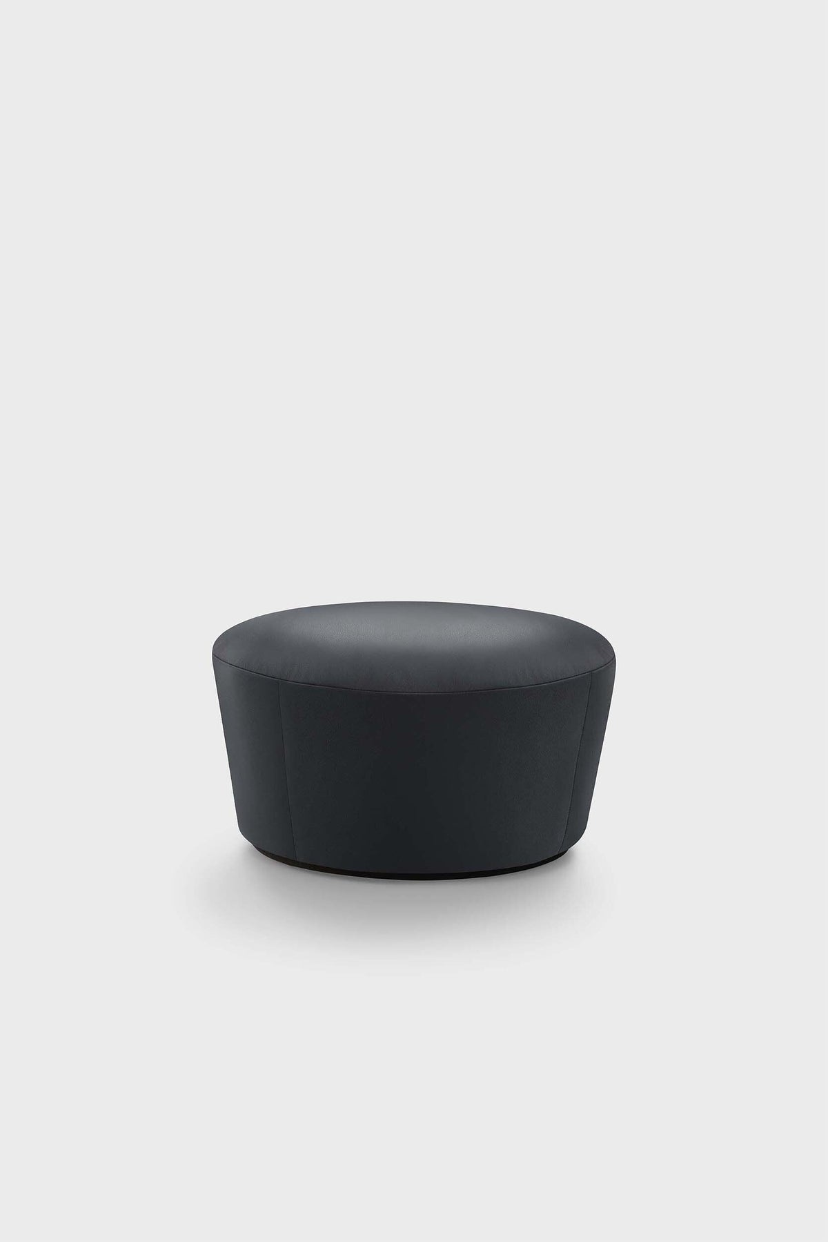 Dark gray pouf with two-tone stitching on a plain background