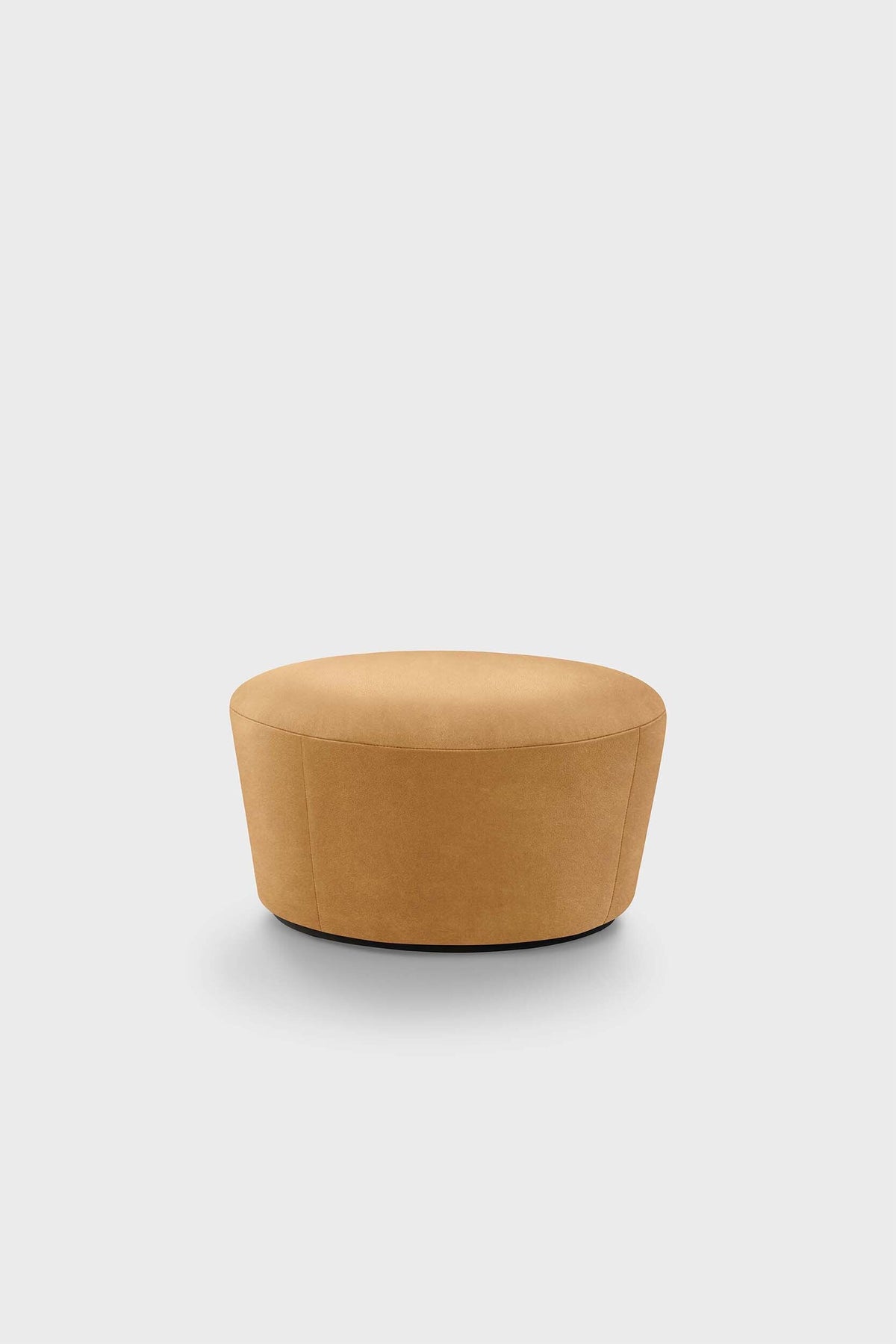 A beige upholstered pouf on a plain background.