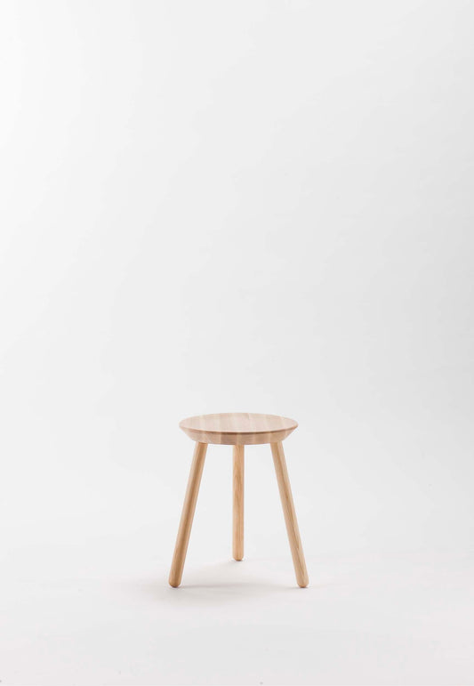 A simple wooden stool with a natural finish, positioned against a plain background.