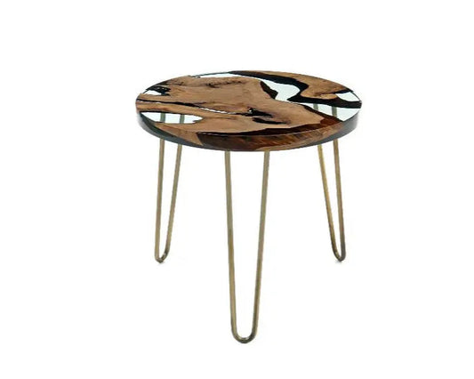 Round accent table with a glass top featuring a marbled pattern, gold hairpin legs, set on a white background.