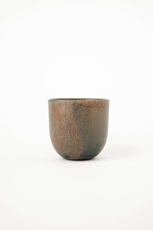 Vintage-inspired stoneware coffee cup with a rustic, textured finish and earthy tones.