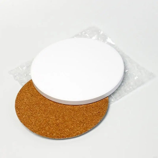 Two circular items: one white ceramic with a textured surface, the other cork with a smooth finish, wrapped in plastic.