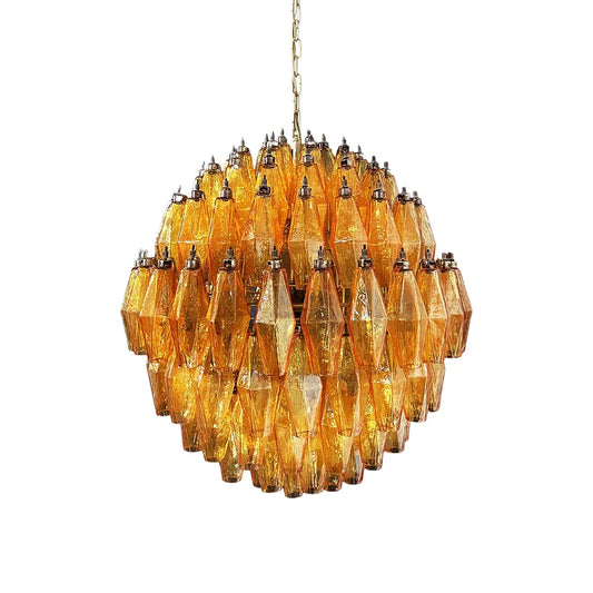 Spherical Murano Poliedri Amber Glass Chandelier with a brass chain hanging against a white background