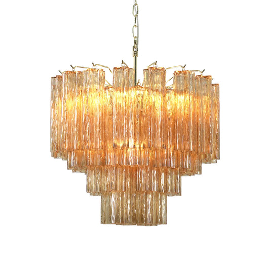 Star-shaped tube amber glass chandelier with illuminated lights against a white background.