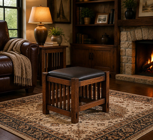Mission Oak Foot Stool with spindles, black cushion, on a patterned rug in a cozy living room setting