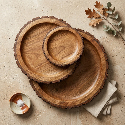 Scalloped wooden platter set with rustic edges, warm brown tones, displayed on a neutral surface.