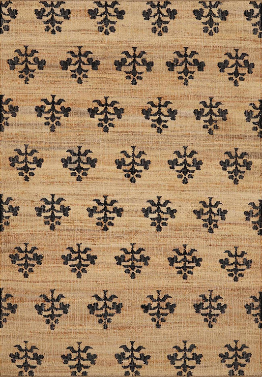 A neutral patterned rug with a repeating geometric design in dark blue and beige tones.
