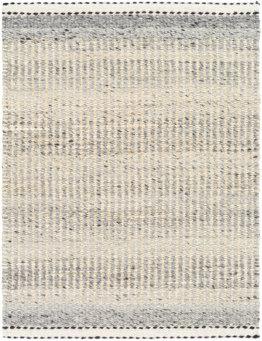 Fiber-woven rug with vertical strips, primarily in gray and white hues, bordered by a detailed black pattern.