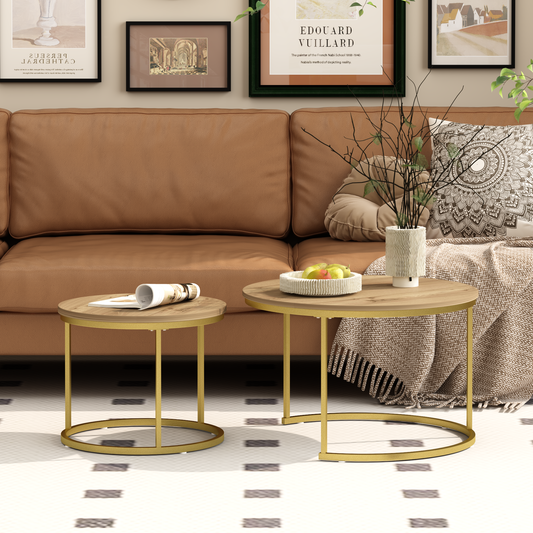 Two round coffee tables with gold frames and wooden tops, neatly arranged in front of a brown sofa.