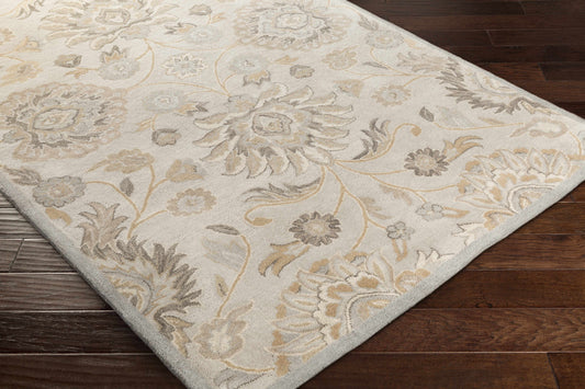 Floral patterned hand tufted rug on wood floor