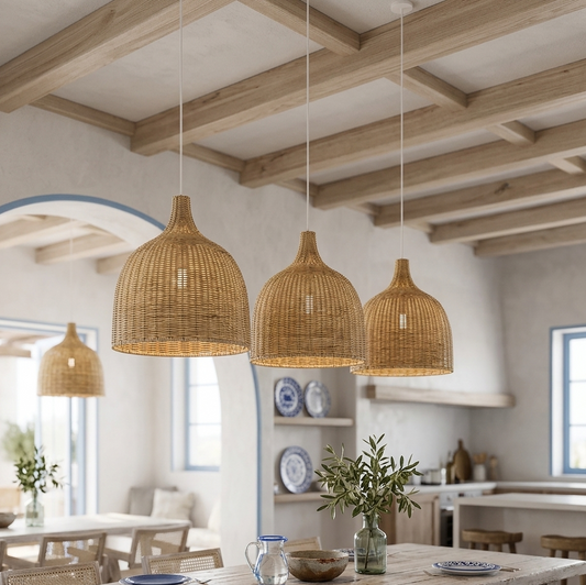 Handwoven rattan pendant lights hanging in a light-filled room with white walls and wooden beams.