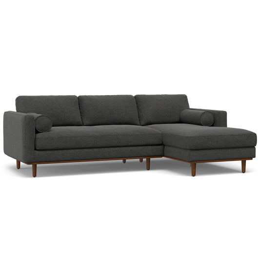 Dark grey sectional sofa with wooden legs.