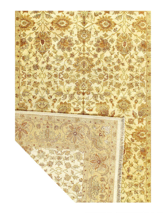 A fine hand-knotted Farahan design rug in beige and brown tones with detailed floral patterns and tassels on the side.