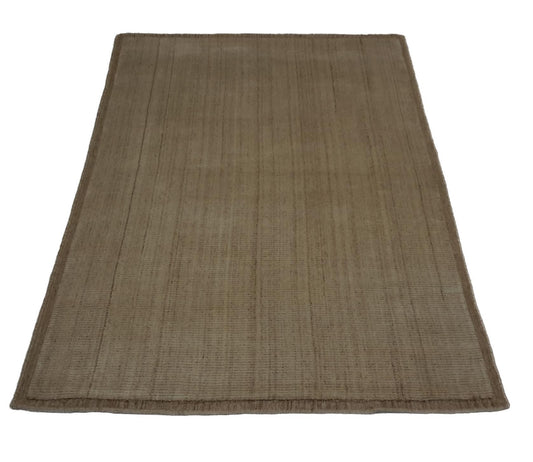 Rectangular rug with natural wool texture in earthy brown tones, no setting shown.