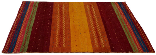 Hand knotted area rug with vibrant striped patterns in red, orange, yellow, and blue tones.