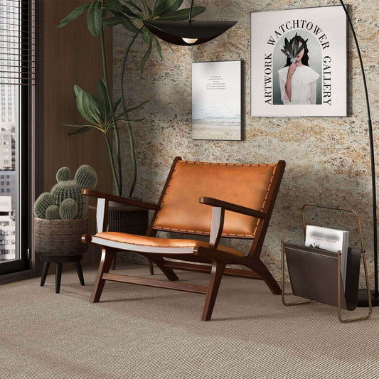 Daniele Mid-Century Modern leather armchair with walnut-finished legs in a warm-toned room with a cactus and minimal decor.