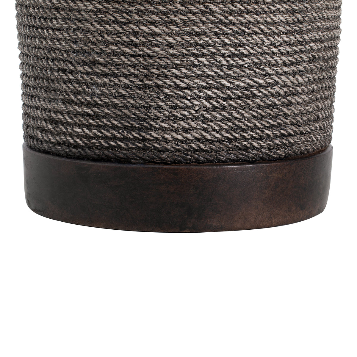 A close-up of a dark brown side table made of woven material with a textured pattern and a wooden base, set against a white background.