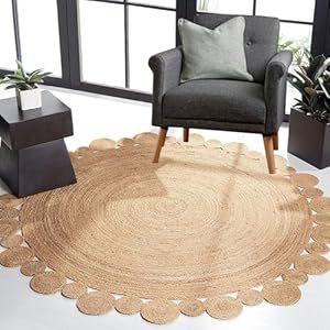 Circular rug with braided edges in natural beige color, placed on a floor in a living room setting