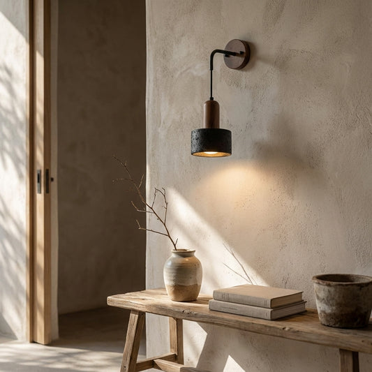 Natural stone and wood wall sconce with adjustable arm, glowing light, and rustic decor