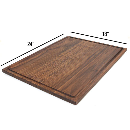 Rectangular walnut cutting board with dimensions marked as 24" x 18