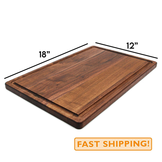 A dark walnut wooden cutting board with dimensions labeled as 18x12 inches, with a juice groove.