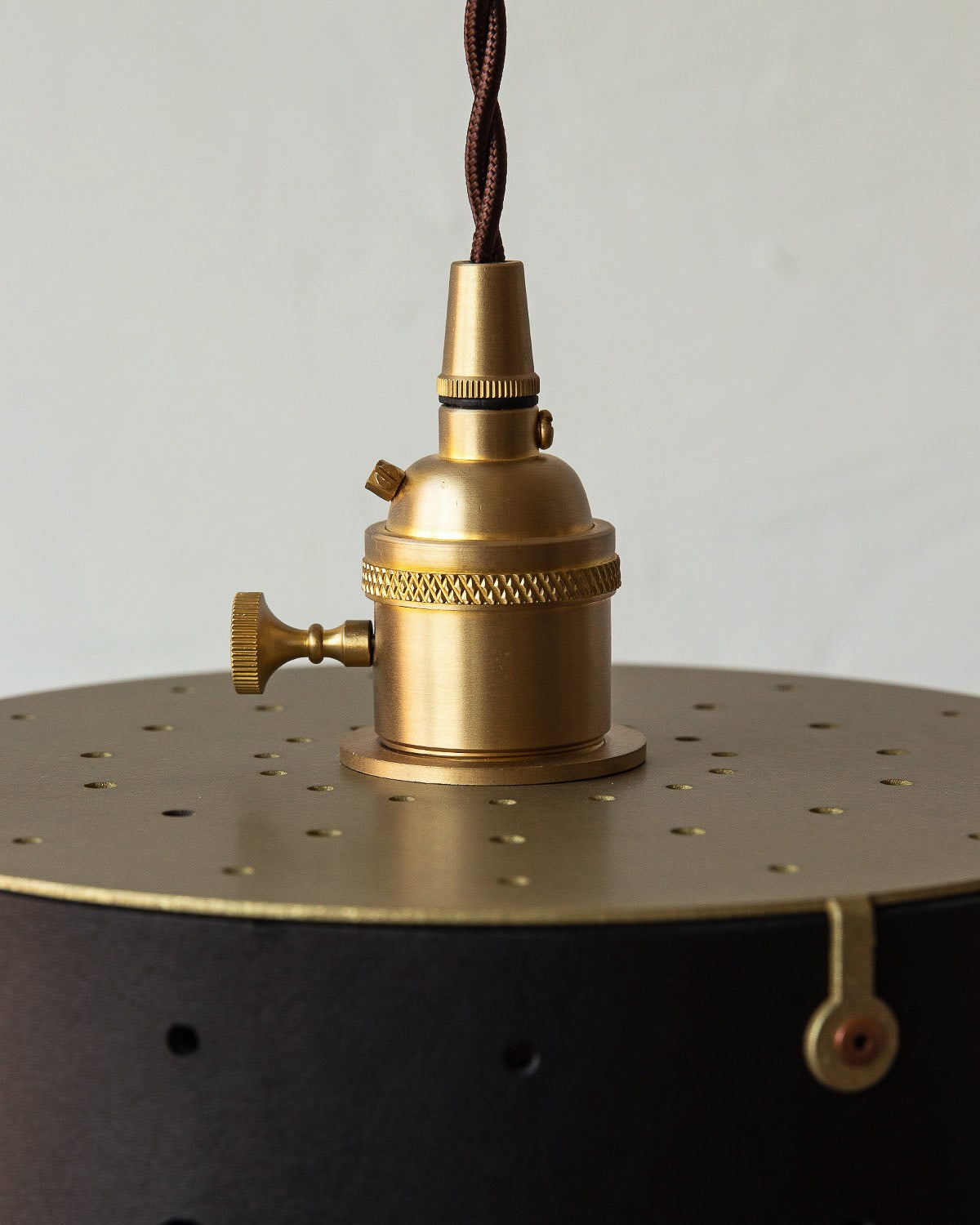 Leather Drum Pendant Light Perforated Plug-In, Black leather, brass fitter close up