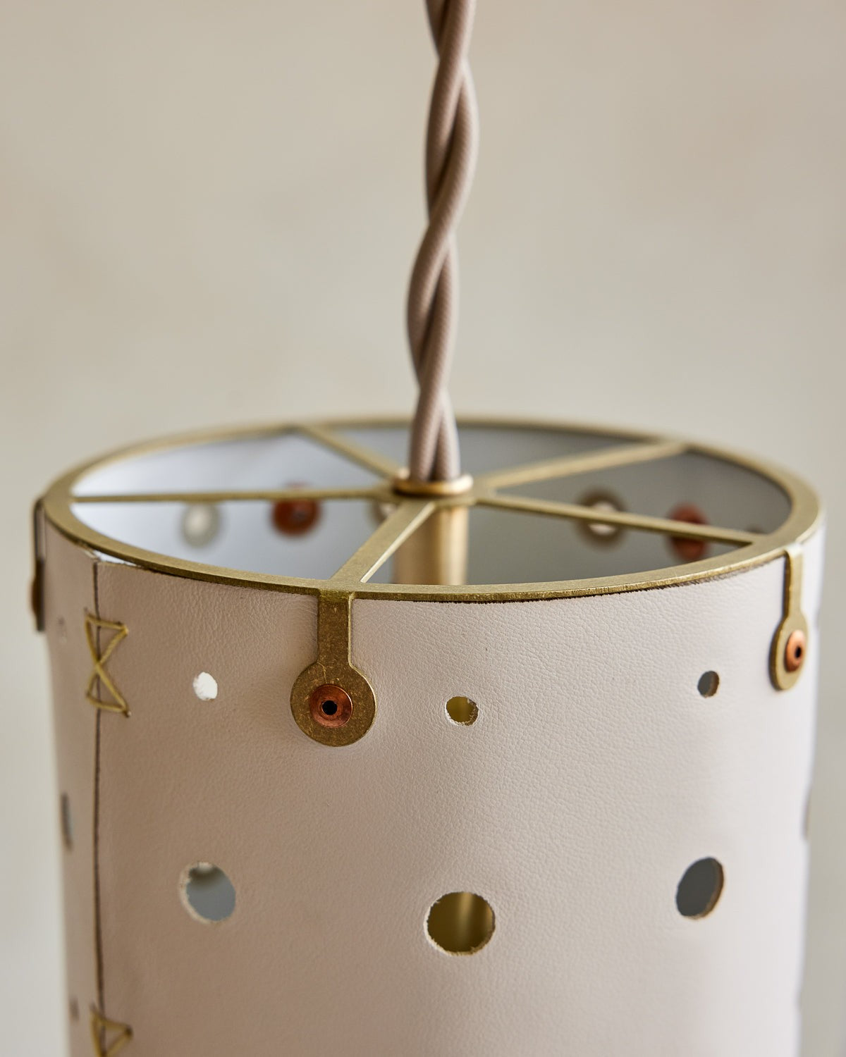 Leather Pendant Light Slim Perforated Cylinder, Dogwood leather, brass fitting close up
