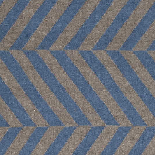 Geometric patterned rug with blue and brown stripes, close-up view.