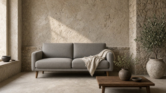 Grey mid-century loveseat in a quiet plaster living room