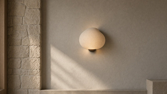 Silk gourd wall sconce on a quiet textured plaster wall