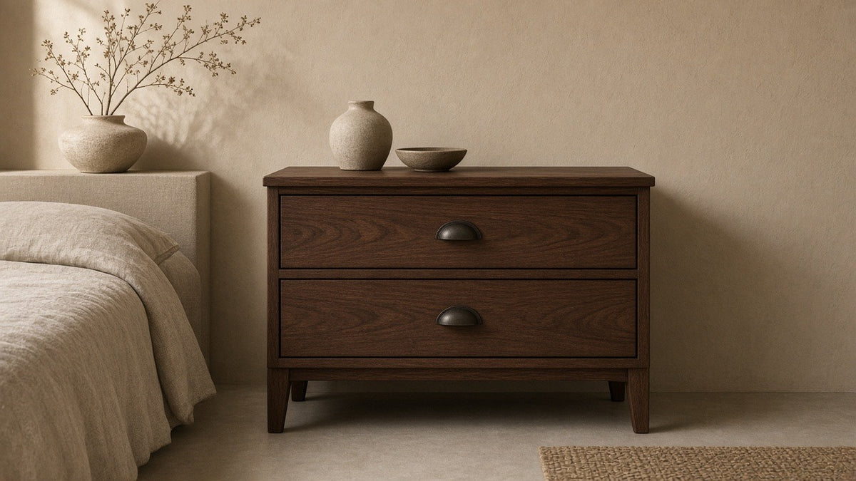 Winslow two-drawer nightstand smokey walnut in empty bedroom, warm plaster walls, soft daylight