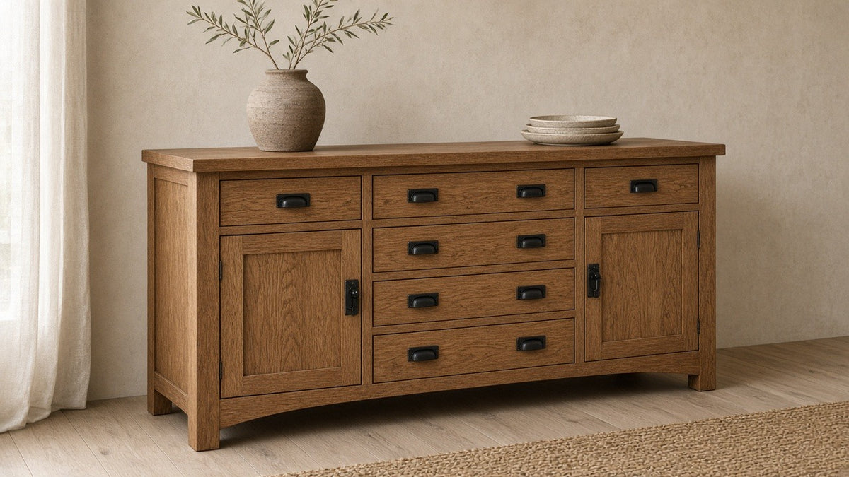 Mission quarter sawn oak 6-drawer sideboard against a warm plaster wall with a clay vase