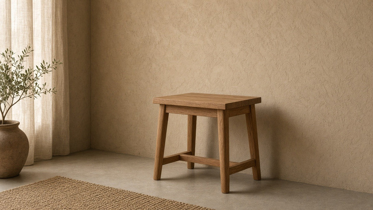 Surat solid wood side table in empty living room, warm plaster walls, soft daylight