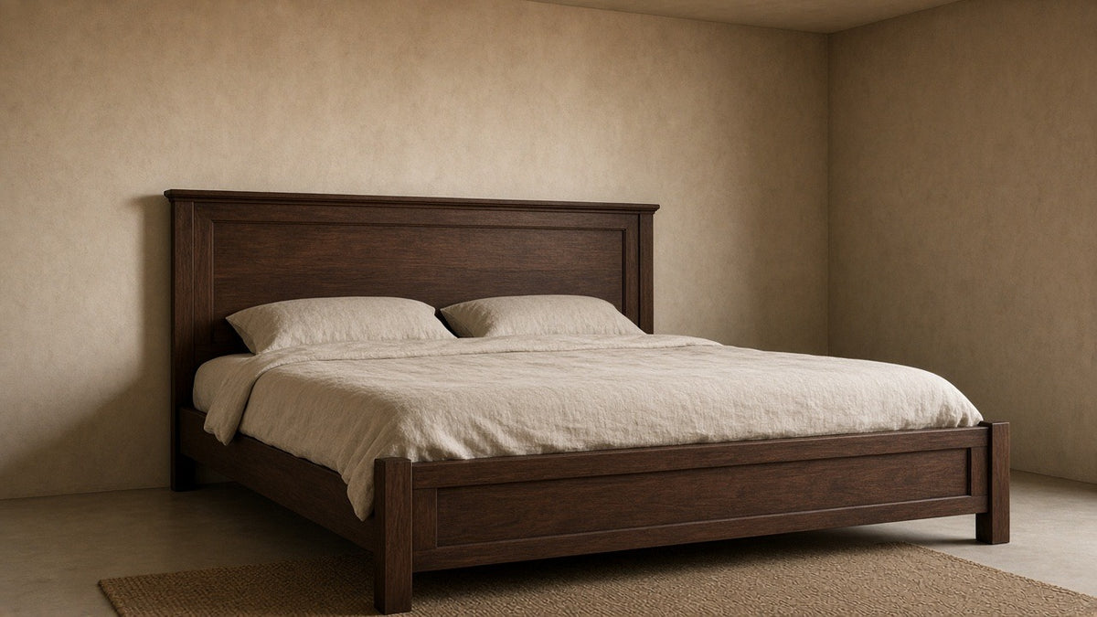 Winslow eastern king panel bed in smokey walnut in empty bedroom, warm plaster walls, soft daylight