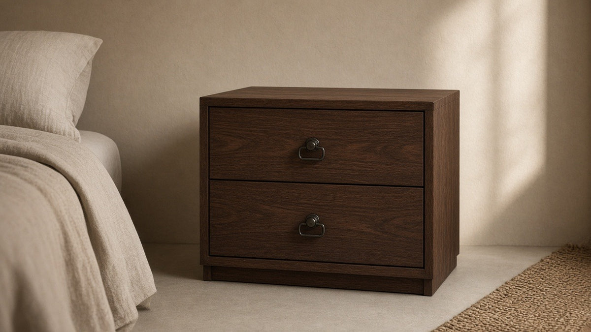Robyn two-drawer nightstand dark walnut in empty bedroom, warm plaster walls, soft daylight