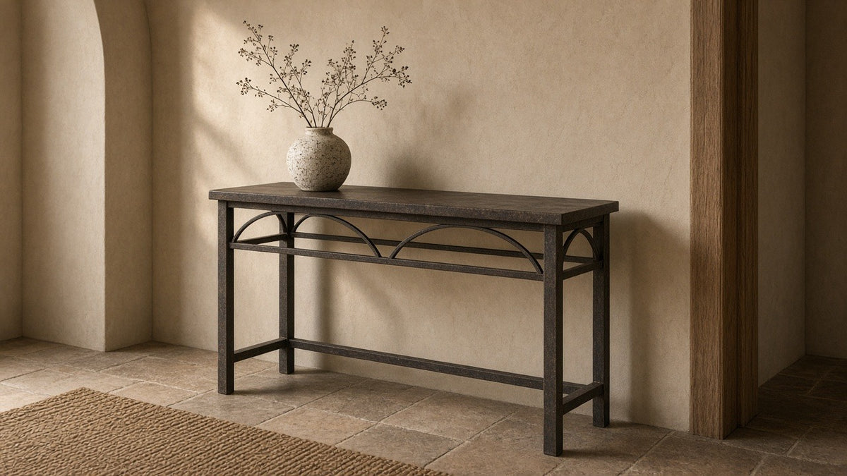 Iron console table 43 by 15 by 36 inches in empty entry hall, warm plaster walls, soft daylight