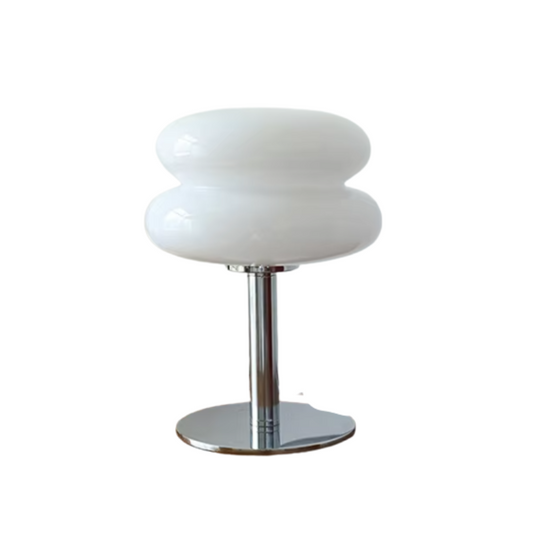 White glossy lamp with bulbous shade on chrome stand, minimalistic design with textured layers.