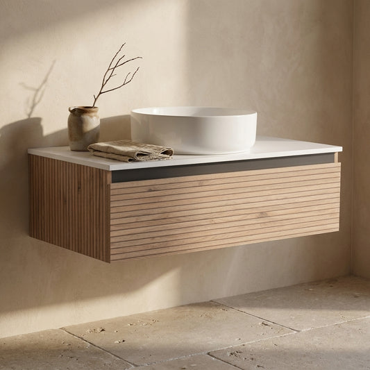 36'' wall-mounted bathroom vanity with wood and white top, showing a sink and towel, set against a plain wall with natural light.