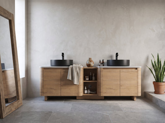 A 72'' wall-mounted bathroom vanity with ceramic art sink, light wood finish, and a minimalist room setting with a large mirror on the left and a potted plant on the right.