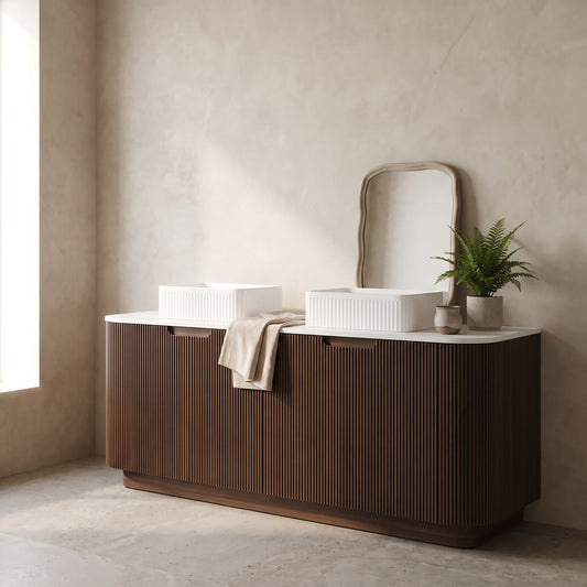 60" bathroom vanity with dark walnut wood finish, glossy white basins, in a minimalist bathroom setting with natural light and a plant decor.