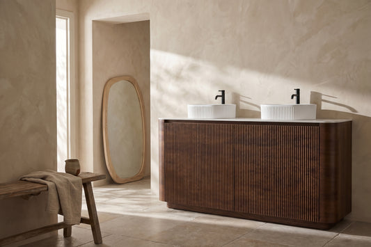 A wooden Erba 72 Inch Bathroom Vanity with two white sinks and black faucets.