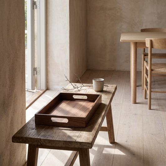 Wooden serving tray on side table with coffee cup