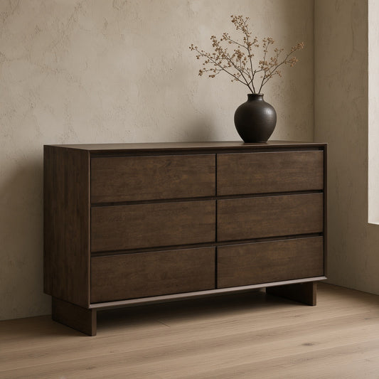 A brown wooden dresser with six drawers in a minimalist room setting.