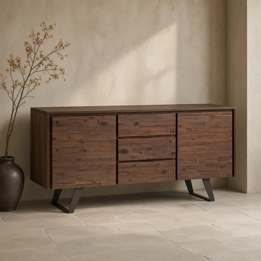 Dark brown Acacia wood sideboard with simple legs, mounted on a light textured wall, next to a vase with a decorative branch, on a tiled floor